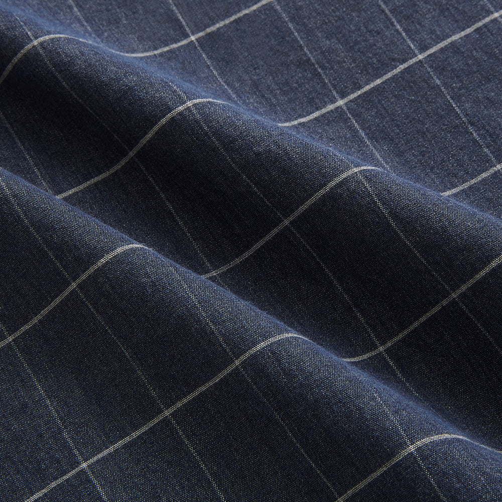 The Turnbull & Asser Royal Blue Check Hampstead Overshirt features a white windowpane pattern, long sleeves, two front pockets, and a chest pocket, displayed on a plain white background for an elegant classic look.