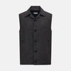 View 1 of product The Turnbull & Asser Ash Collared Linen Waistcoat is a sleeveless dark gray piece with a button-down front, two zippered side pockets, and a small chest pocket, shown against a plain white background.