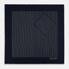 View 4 of product A Navy and Grey Stripe Silk Pocket Square by Turnbull & Asser, featuring hand-rolled edges and brand text in the corner. One corner is folded to show the reverse side.