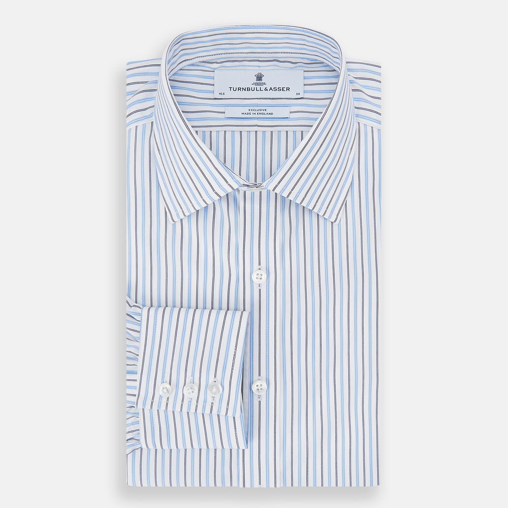 The Turnbull & Asser Blue Multi Halo Stripe Mayfair Shirt features long sleeves, a T&A collar with pointed tips, and buttoned cuffs, shown on a plain white background.