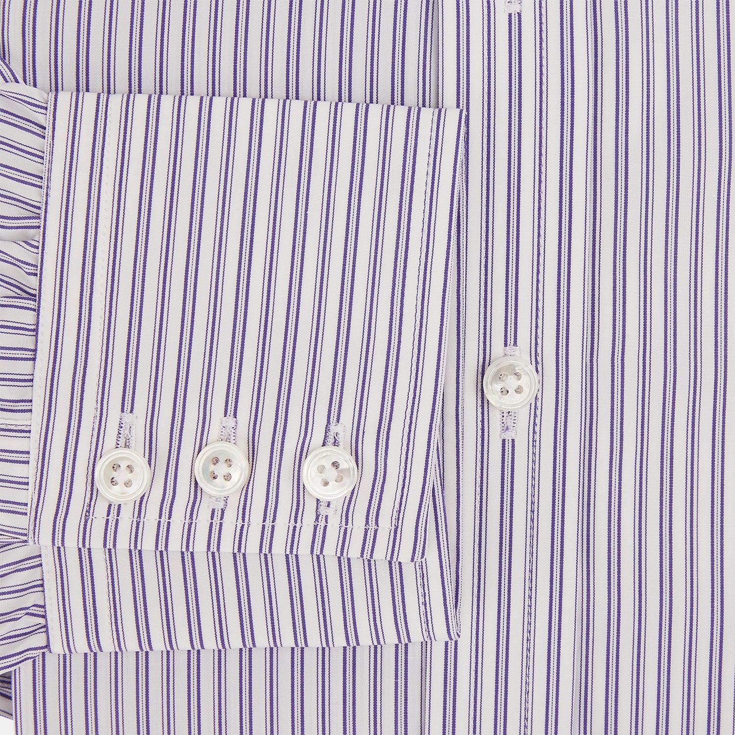 View 4 of product The Turnbull & Asser Purple Ticking Stripe Mayfair Shirt is a long-sleeve button-up with a T&A collar and slim blue-and-white vertical stripes, shown on a white background.