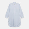 View 1 of product The Turnbull & Asser Blue and Yellow Stripe Poplin Cotton Nightshirt features light blue and yellow vertical stripes, long sleeves, a classic collar, single chest pocket, rounded hem, and is displayed flat on a white background.