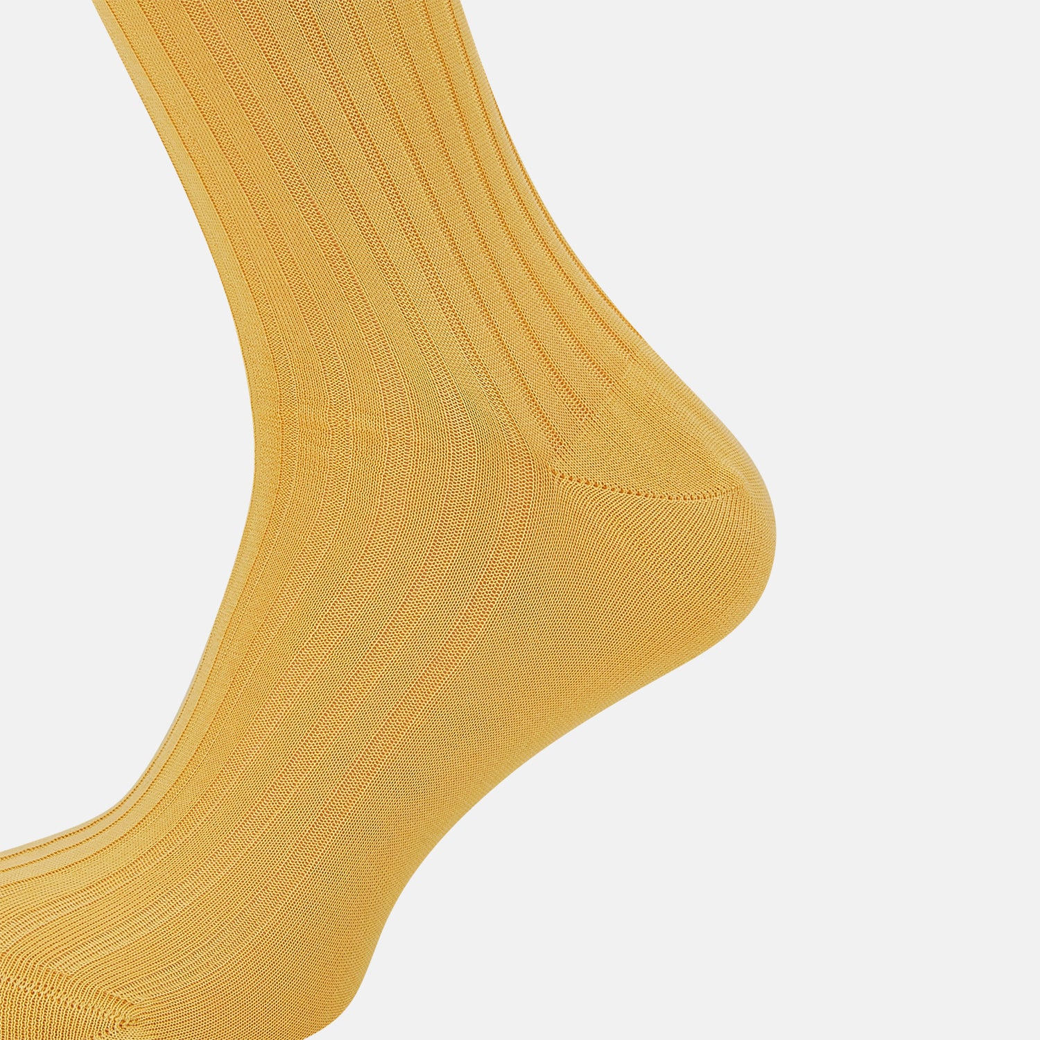 View 4 of product The Turnbull & Asser Banana Long Socks are knee-high, golden-yellow, and made from mercerised Egyptian cotton, shown upright on a white background to highlight their ribbed texture and fitted shape.