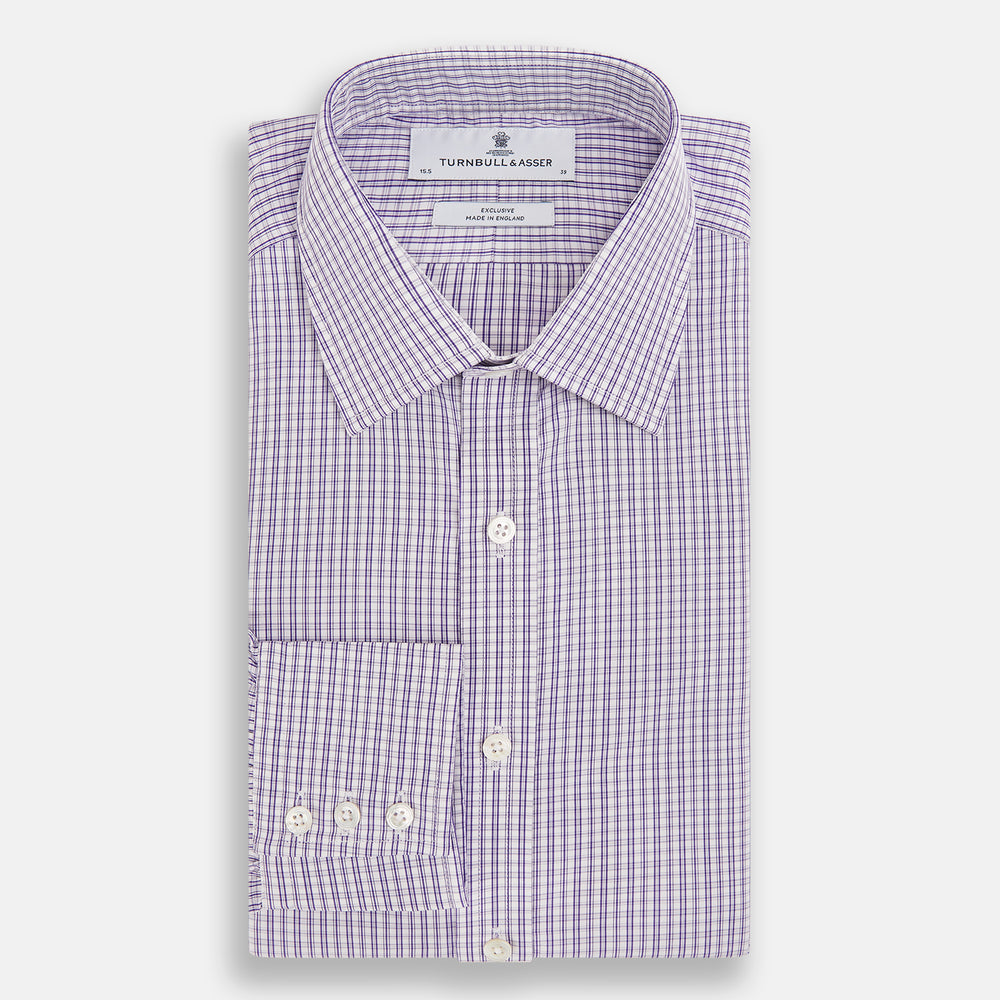 The Turnbull & Asser Purple Double Graph Check Mayfair Shirt is a long-sleeved, button-up dress shirt with a T&A collar and small blue and white check pattern, shown against a white background.