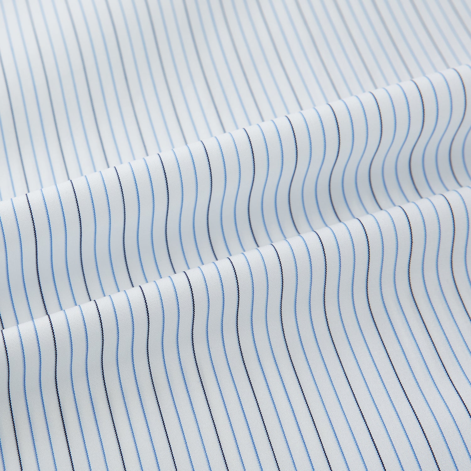 View 6 of product The Navy and Blue Pinstripe Mayfair Shirt by Turnbull & Asser, featuring a classic collar and crafted from premium Italian cotton, is shown against a white background.