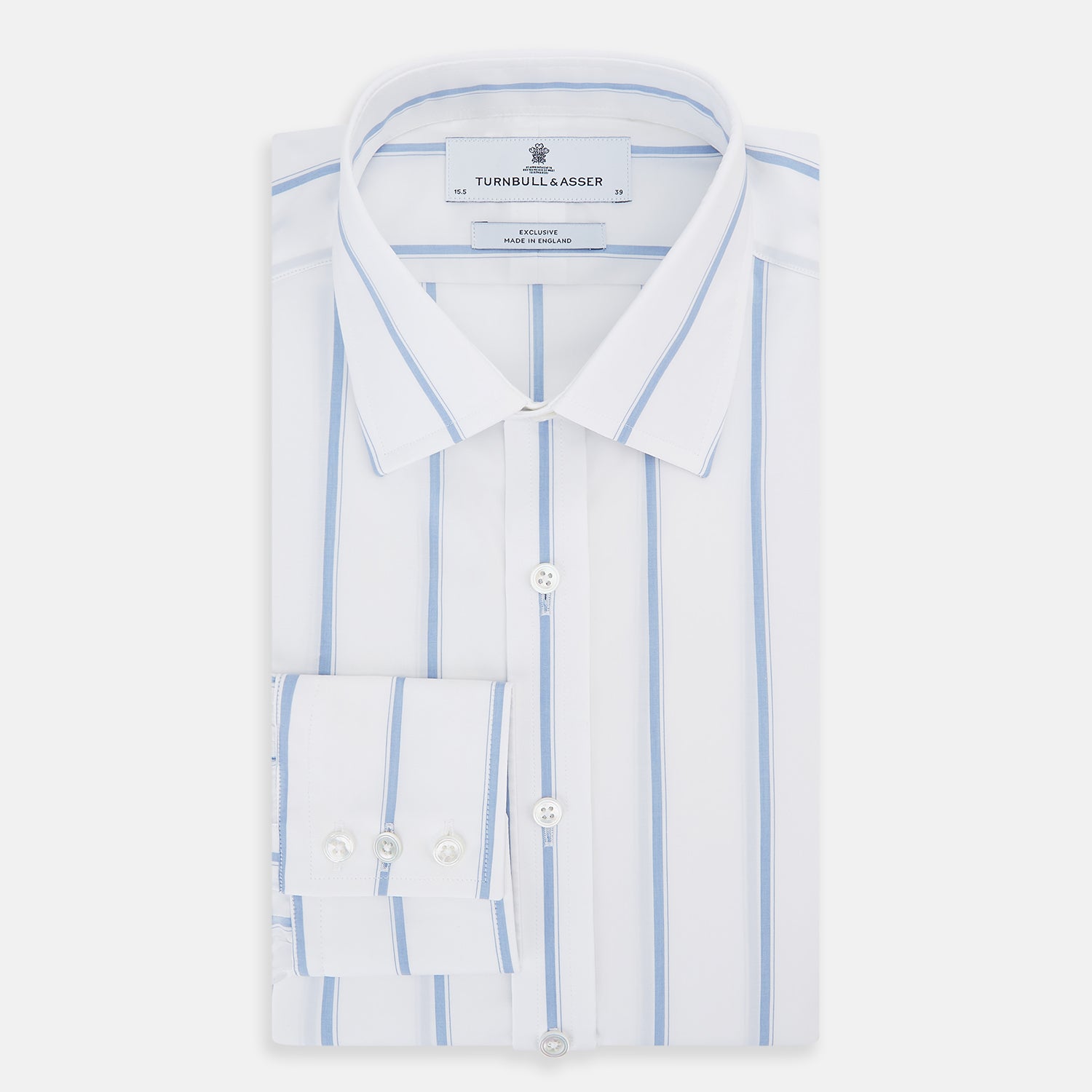 View 5 of product The Colony Blue Track Stripe Mayfair Shirt by Turnbull & Asser is a long-sleeve, button-up Italian cotton shirt with a white base and blue stripes, pointed collar, and buttoned cuffs, shown laid flat on a white background.