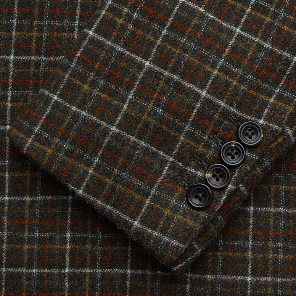 The Green Multi Check Cashmere Barrington Blazer by Turnbull & Asser, featuring a single-breasted design, notched lapel, and two front flap pockets, is shown laid flat on a white background.