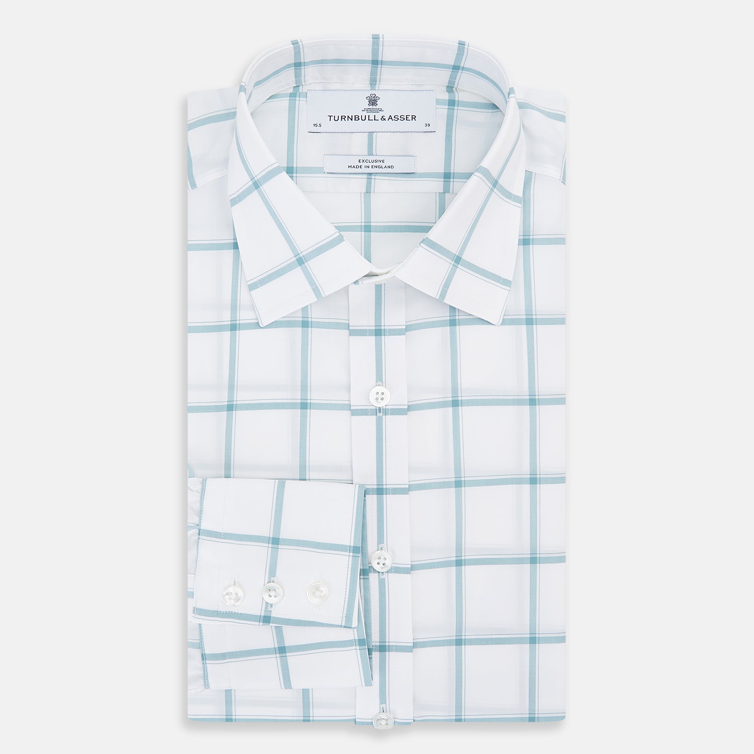 View 5 of product The Turnbull & Asser Sage Grid Check Mayfair Shirt is a white, long-sleeve shirt made from Italian cotton with a light blue and sage grid pattern, shown neatly laid flat on a plain, light background.