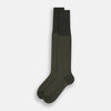 View 2 of product A single Forest Green Motif Long Sock from Turnbull & Asser, crafted from soft mercerised Egyptian cotton, features a subtle pattern, ribbed cuff, and left-foot shaping, displayed on a light background.