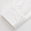 View 2 of product The White Cotton Weekend Fit Langston Shirt by Turnbull & Asser, with a Derby collar, long sleeves, and two button-flap chest pockets, is shown laid flat on a white background.