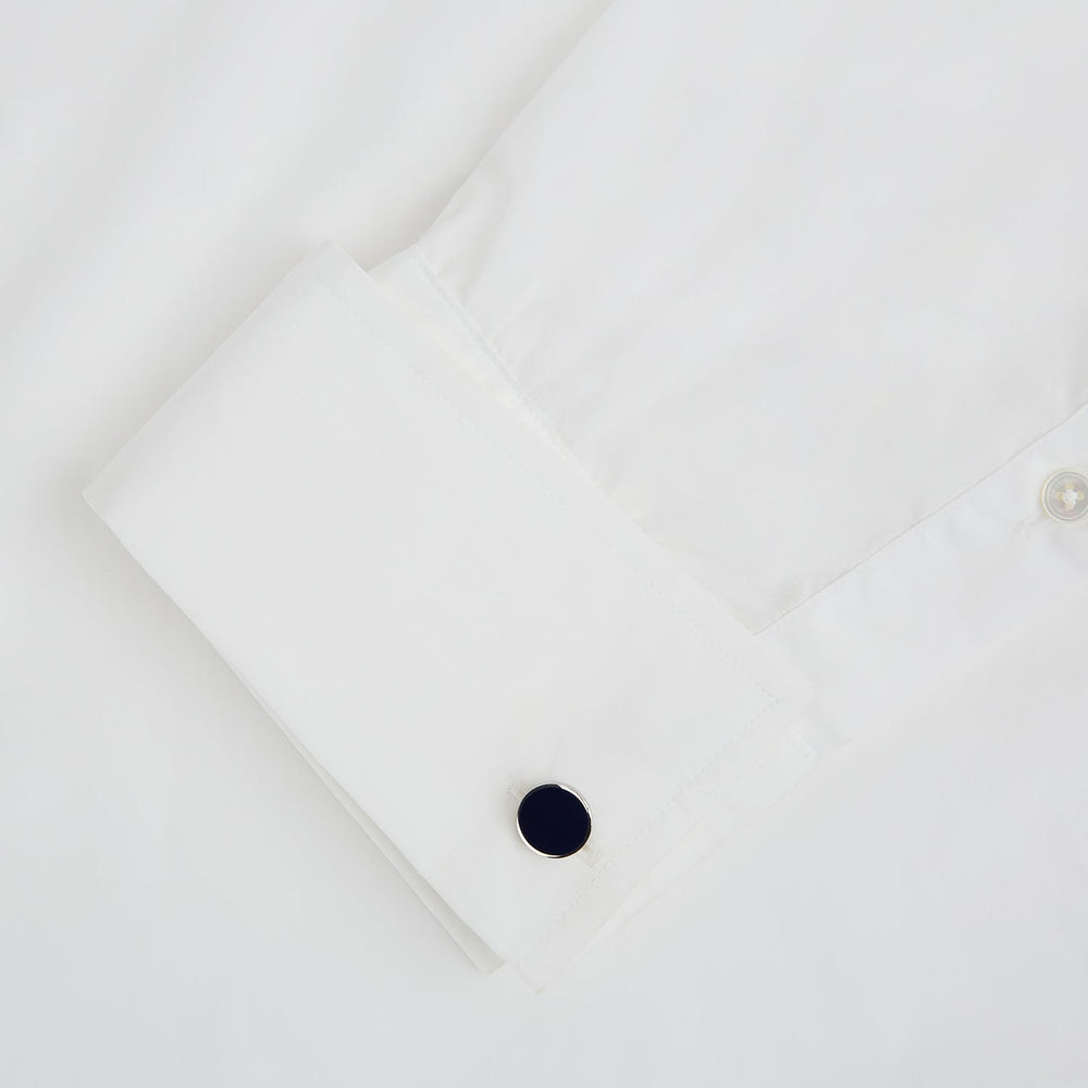 Turnbull & Asser’s Navy Circle Cufflinks feature round sterling silver with deep navy faces, shown on a white background—a classic men’s accessory.