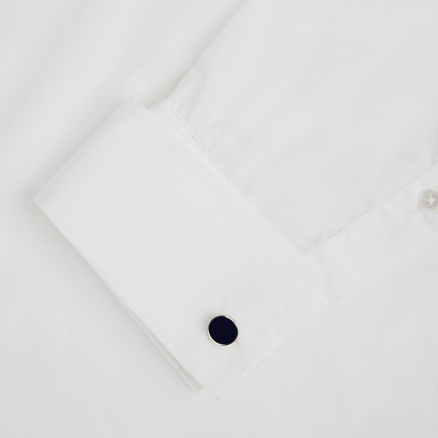 View 3 of product Turnbull & Asser’s Navy Circle Cufflinks feature round sterling silver with deep navy faces, shown on a white background—a classic men’s accessory.