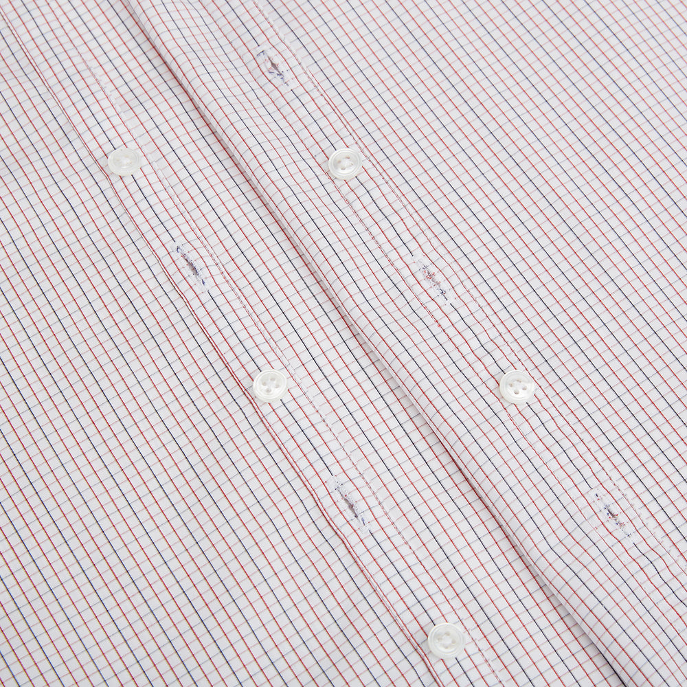 The Turnbull & Asser Red and Navy Check Windsor Shirt features a pointed collar and cuffed long sleeves, highlighting British craftsmanship. Displayed flat on a white background.