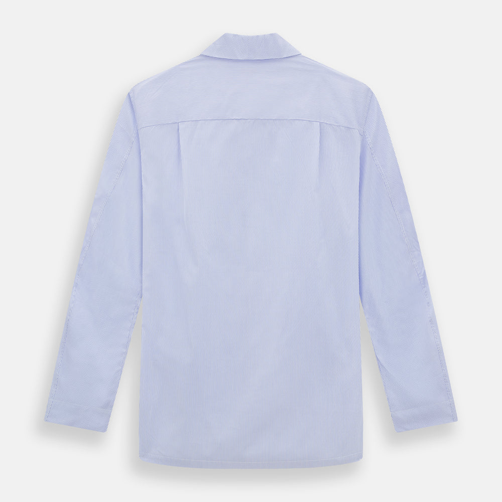 The Turnbull & Asser Pale Blue Hairline Stripe Pyjama Shirt features long sleeves and a single chest pocket, offering an elegant sleepwear style—shown on a plain white background.