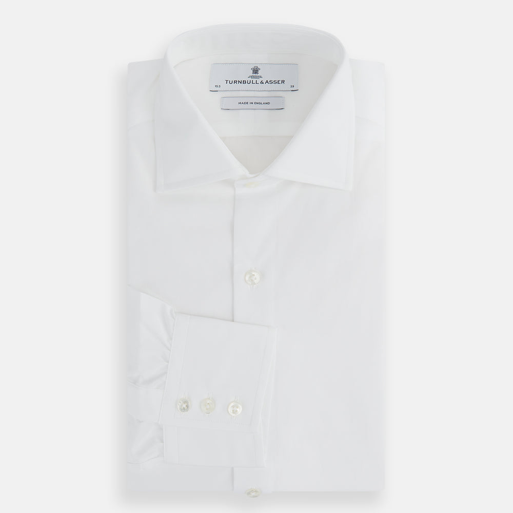 The Turnbull & Asser Tailored Fit Plain White Cotton Shirt features a classic kent collar and 3-button cuffs, displayed against a white background.