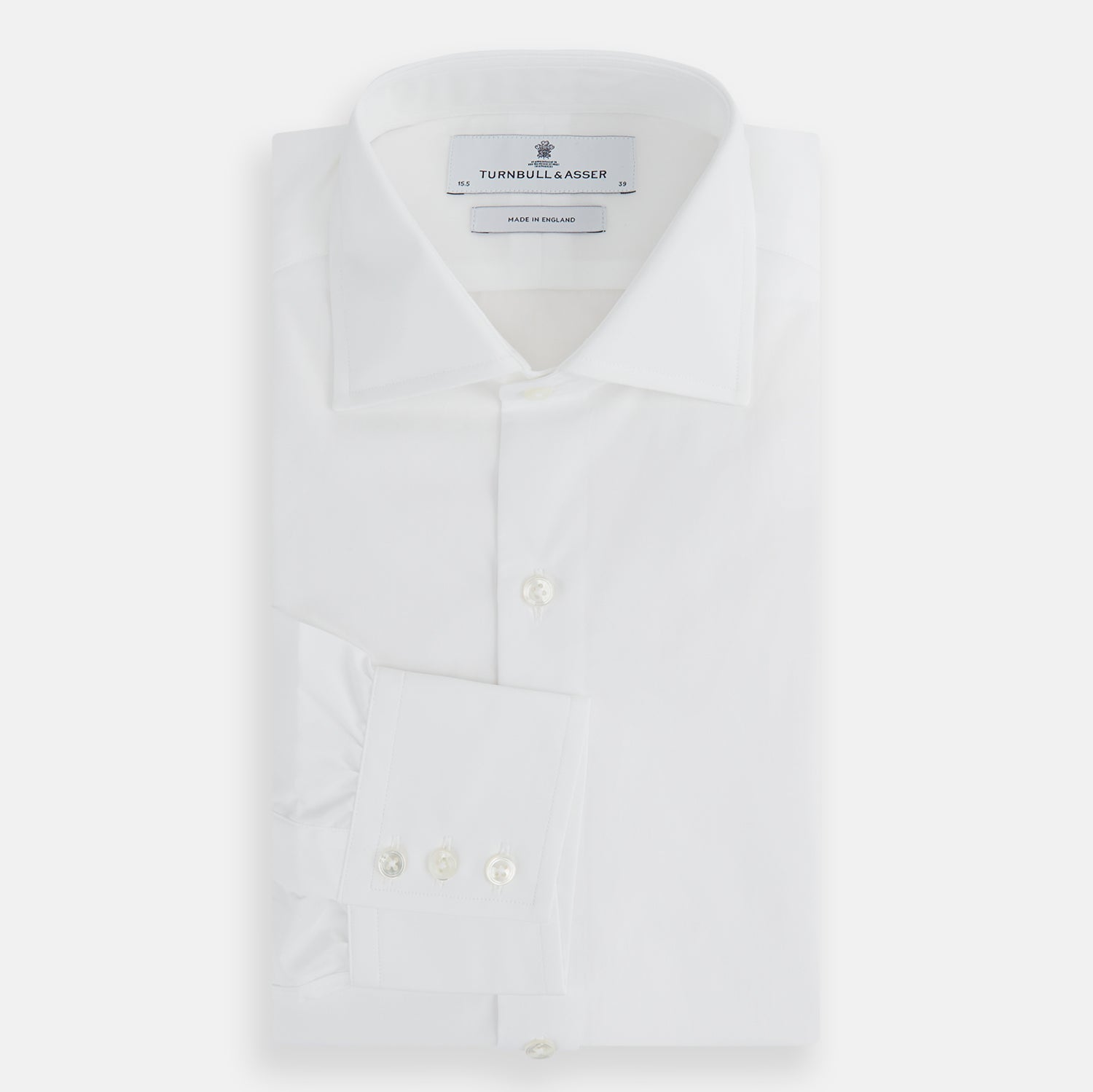 View 4 of product The Turnbull & Asser Tailored Fit Plain White Cotton Shirt features a classic kent collar and 3-button cuffs, displayed against a white background.