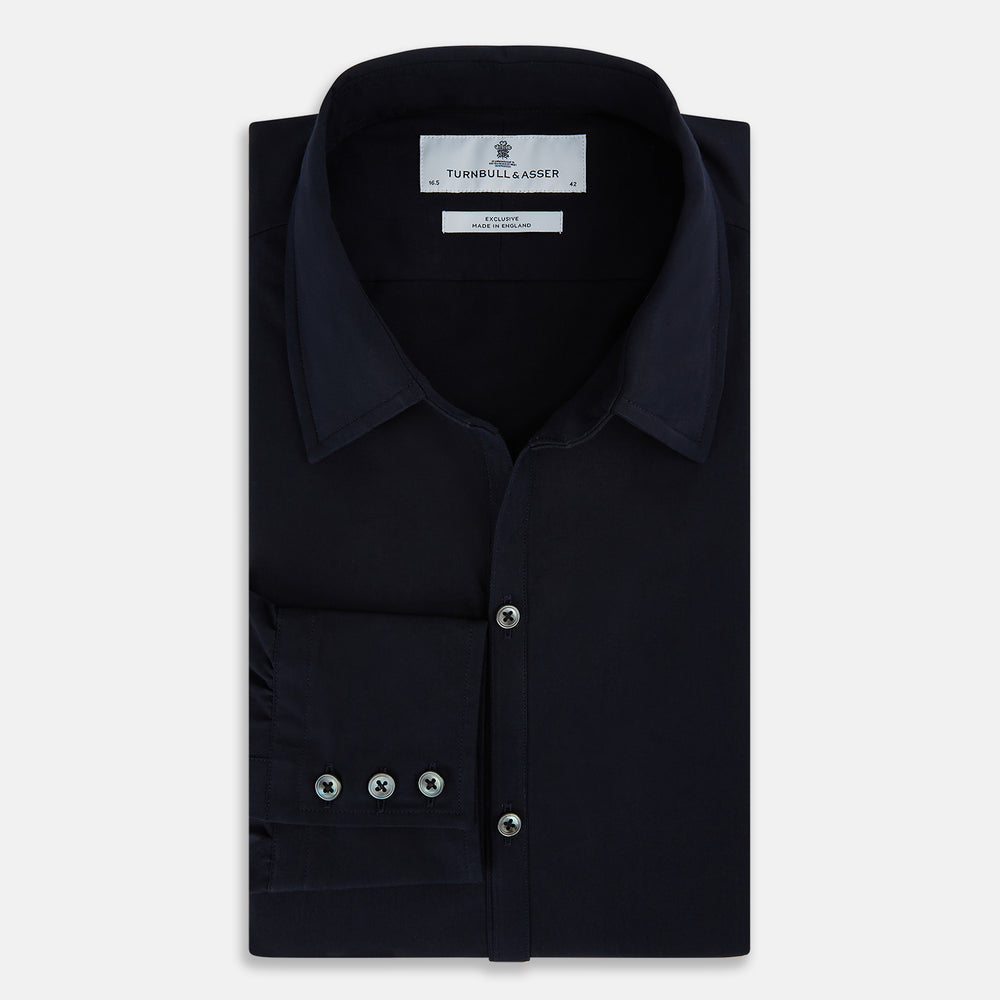 The NAVY BLUE WINDSOR SHIRT by Turnbull & Asser features long sleeves, a classic Windsor collar, white buttons, and buttoned cuffs—highlighting refined British craftsmanship against a plain white background.