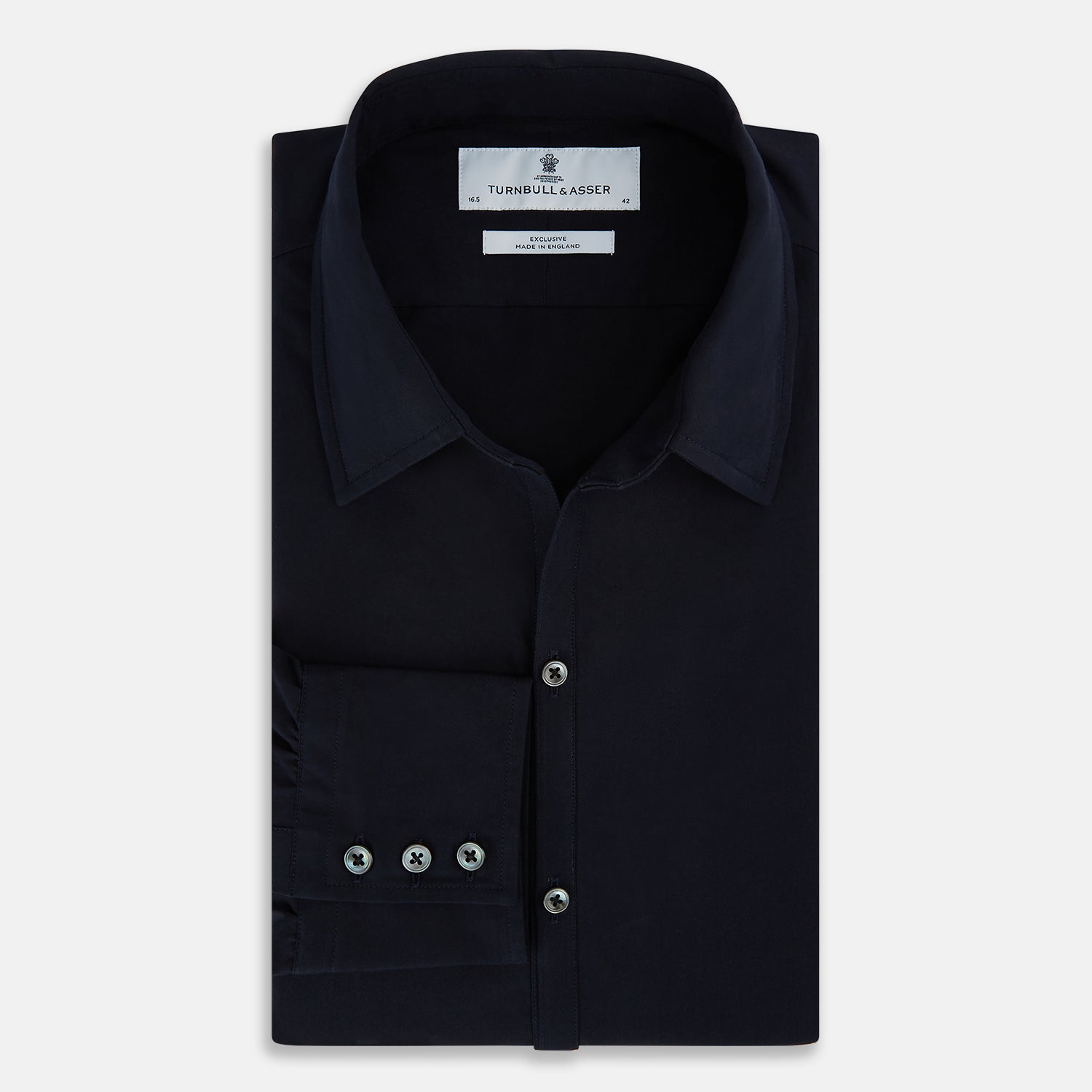 View 5 of product The NAVY BLUE WINDSOR SHIRT by Turnbull & Asser features long sleeves, a classic Windsor collar, white buttons, and buttoned cuffs—highlighting refined British craftsmanship against a plain white background.