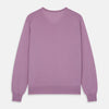 View 3 of product The Pink Merino Kennedy V-Neck Jumper by Turnbull & Asser features long sleeves with ribbed cuffs and waistband, shown on a plain white background—ideal for knitwear lovers.