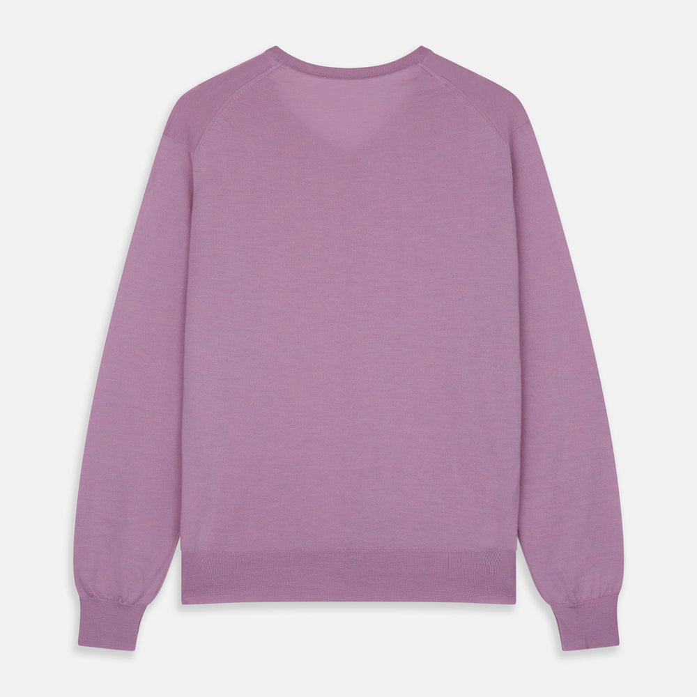 The Pink Merino Kennedy V-Neck Jumper by Turnbull & Asser features long sleeves with ribbed cuffs and waistband, shown on a plain white background—ideal for knitwear lovers.