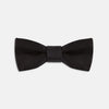 View 1 of product The Turnbull & Asser Black Batwing Satin Bow Tie features a smooth, matte finish and is neatly tied on a plain white background—ideal for formal occasions.