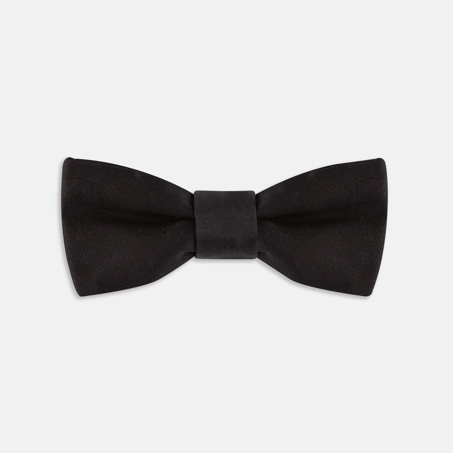View 1 of product The Turnbull & Asser Black Batwing Satin Bow Tie features a smooth, matte finish and is neatly tied on a plain white background—ideal for formal occasions.