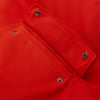 View 8 of product Wearing the Turnbull & Asser Red Walter Sealup Parka with Detachable Liner, black pants, and white sneakers, a person stands in profile against a plain light background—perfect for travel.