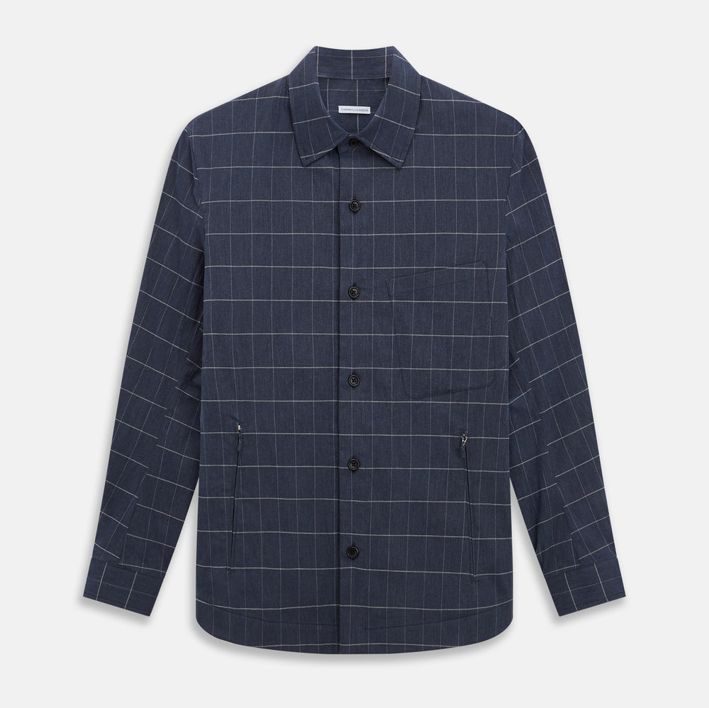 The Turnbull & Asser Royal Blue Check Hampstead Overshirt features a white windowpane pattern, long sleeves, two front pockets, and a chest pocket, displayed on a plain white background for an elegant classic look.