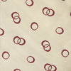 View 3 of product The Yellow Geometric Rings Silk Tie by Turnbull & Asser features a cream silk base with yellow geometric patterns and maroon rings, is hand-finished in England, and is shown rolled up on a white background.