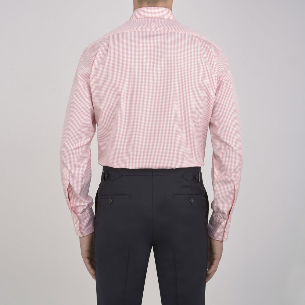 The Turnbull & Asser Light Pink Gingham Check Shirt features a classic T&A collar, 3-button cuffs, and white buttons, neatly folded on a plain white background.