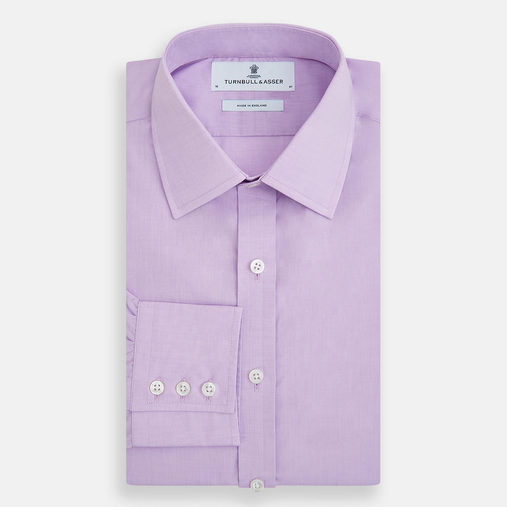 The Turnbull & Asser Purple Pink Mayfair Shirt is a men's formal, long-sleeve button-up with a classic collar and buttoned cuffs, shown in light purple against a plain white background.