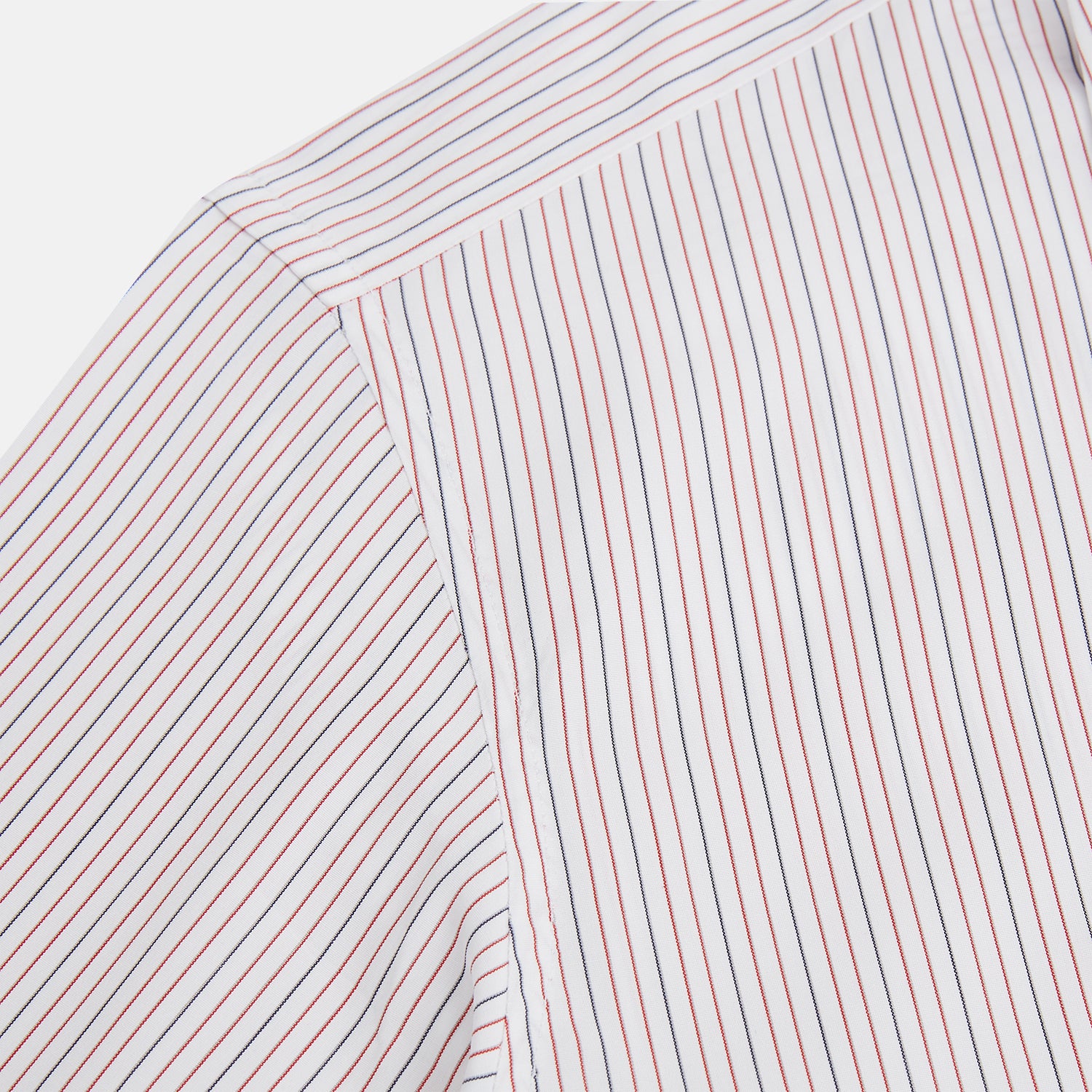View 6 of product The Turnbull & Asser Red and Blue Ticking Stripe Westminster Shirt features long sleeves, a button-up front, pointed collar, and buttoned cuffs, highlighting British craftsmanship while laid flat on a white background.