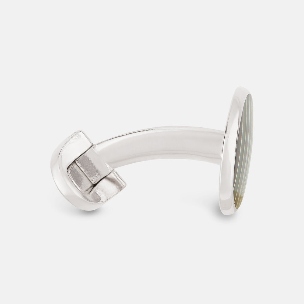 The Forest Green and Navy Striped Oval Enamel Cufflinks by Turnbull & Asser feature artisanal craftsmanship and a bold, masculine design, with elegant stripes set on a classic silver finish against a sophisticated white backdrop.