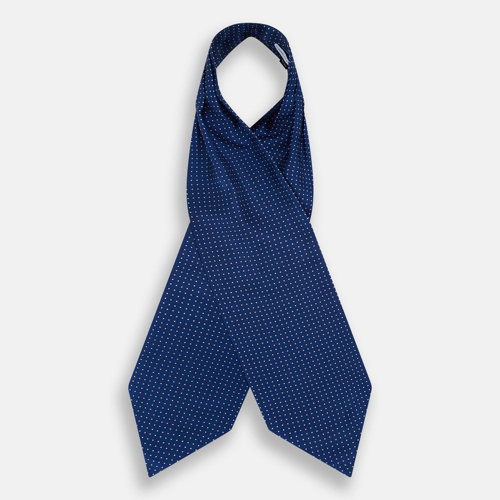 The Turnbull & Asser Pink Dot and Royal Blue Silk Cravat is an elegant British-style wedding accessory, neatly folded with a pointed edge and finished with pink dots, perfect for complementing formal attire.