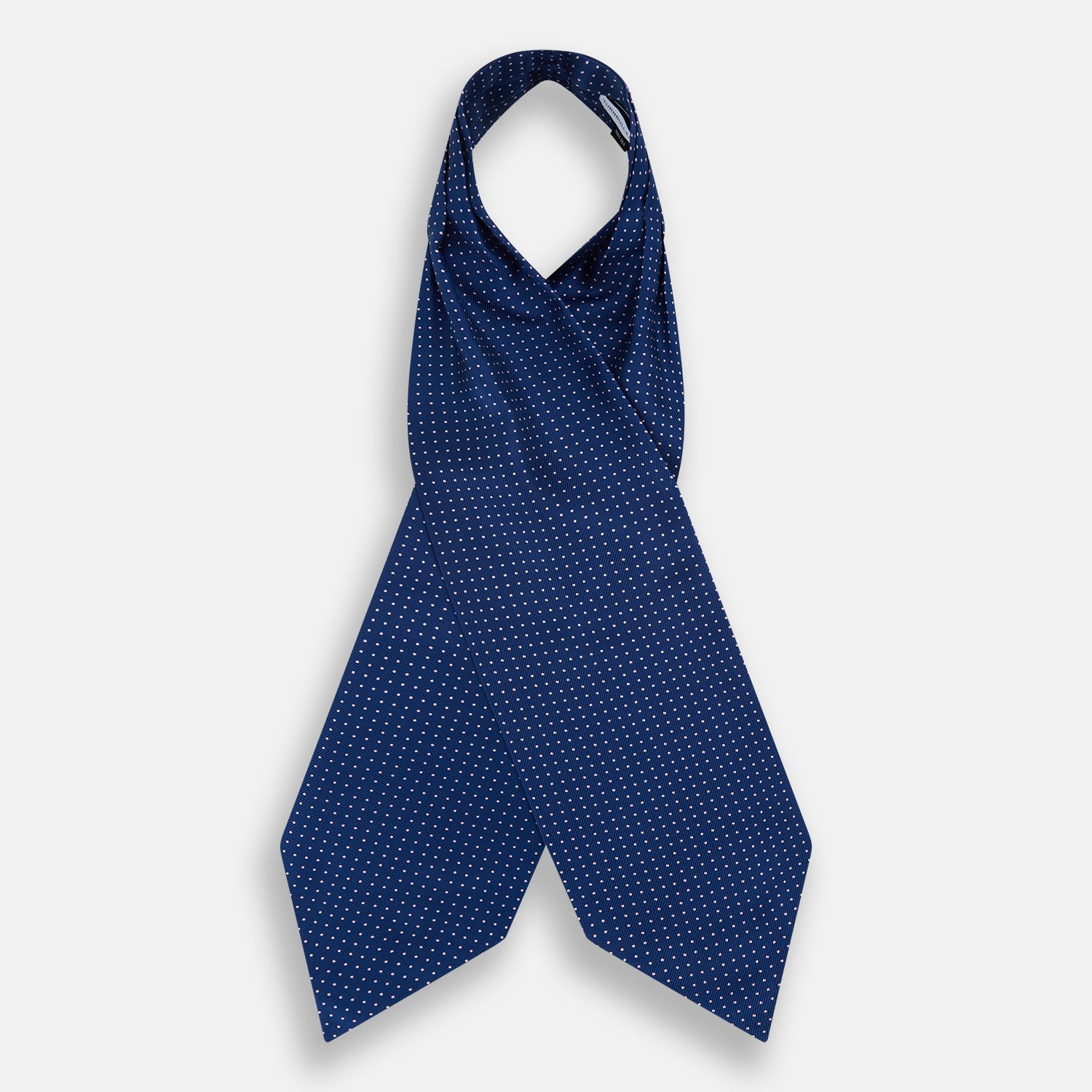 View 2 of product The Turnbull & Asser Pink Dot and Royal Blue Silk Cravat is an elegant British-style wedding accessory, neatly folded with a pointed edge and finished with pink dots, perfect for complementing formal attire.