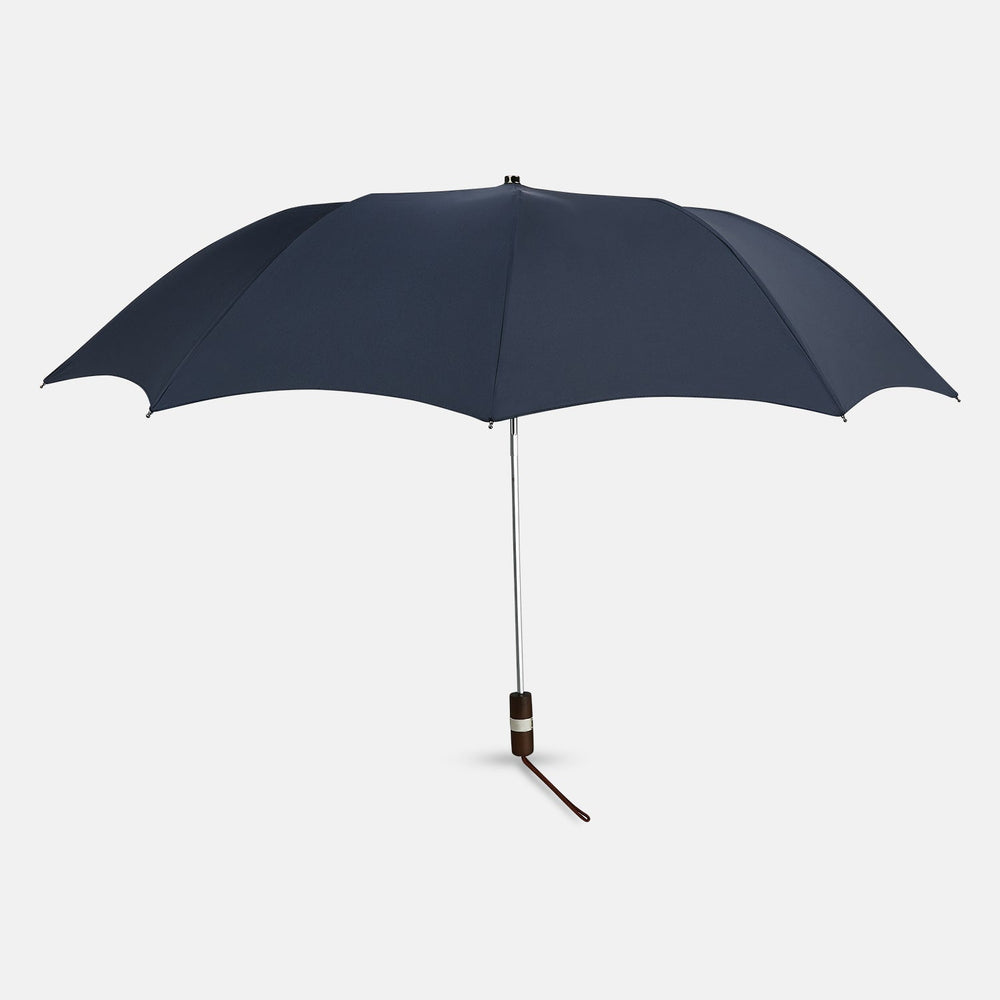 The Navy Telescopic Umbrella by Turnbull & Asser features a brown maple handle with wrist strap, a straight metal shaft, and is shown fully opened against a plain white background.