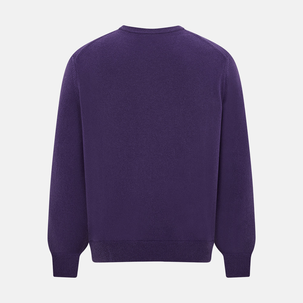 The Turnbull & Asser Purple Cashmere Round Neck Jumper features long sleeves, ribbed cuffs, hem, and collar for an elegant silhouette. This versatile knitwear piece is shown against a white background.