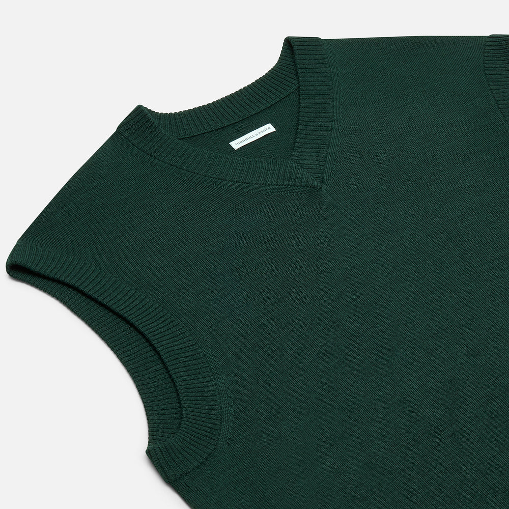 Turnbull & Asser's Petrol Green Fine Merino V-Neck Vest is shown from the front on a white background, highlighting its classic and simple sleeveless design.