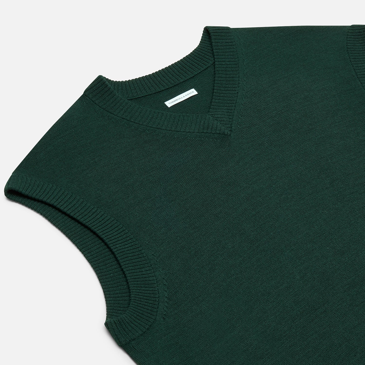 View 2 of product Turnbull & Asser's Petrol Green Fine Merino V-Neck Vest is shown from the front on a white background, highlighting its classic and simple sleeveless design.