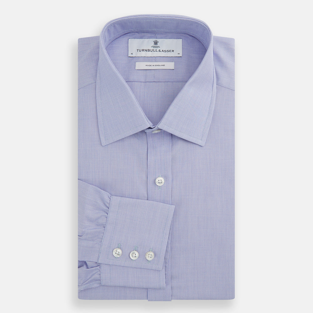 The Turnbull & Asser Blue End-on-End Cotton Shirt features a T&A collar and 3-button cuffs, perfect for pairing with a navy suit or smart ensemble, and is displayed flat against a white background.