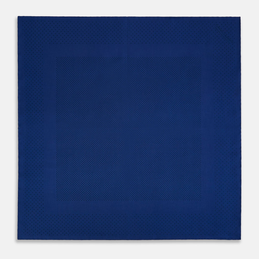 The Turnbull & Asser Navy Dot Silk Pocket Square, folded with neat hand-rolled edges, features a subtle navy polka dot pattern on dark blue silk and is shown against a white background.