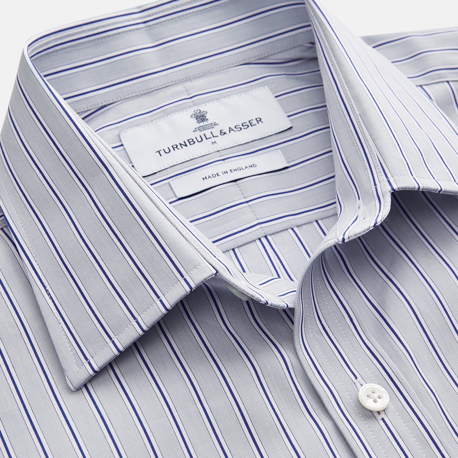 View 2 of product Turnbull & Asser Navy & Blue Stripe Weekend Fit Shirt, featuring a Derby collar, single button cuffs, and a chest pocket, laid flat on a white background.