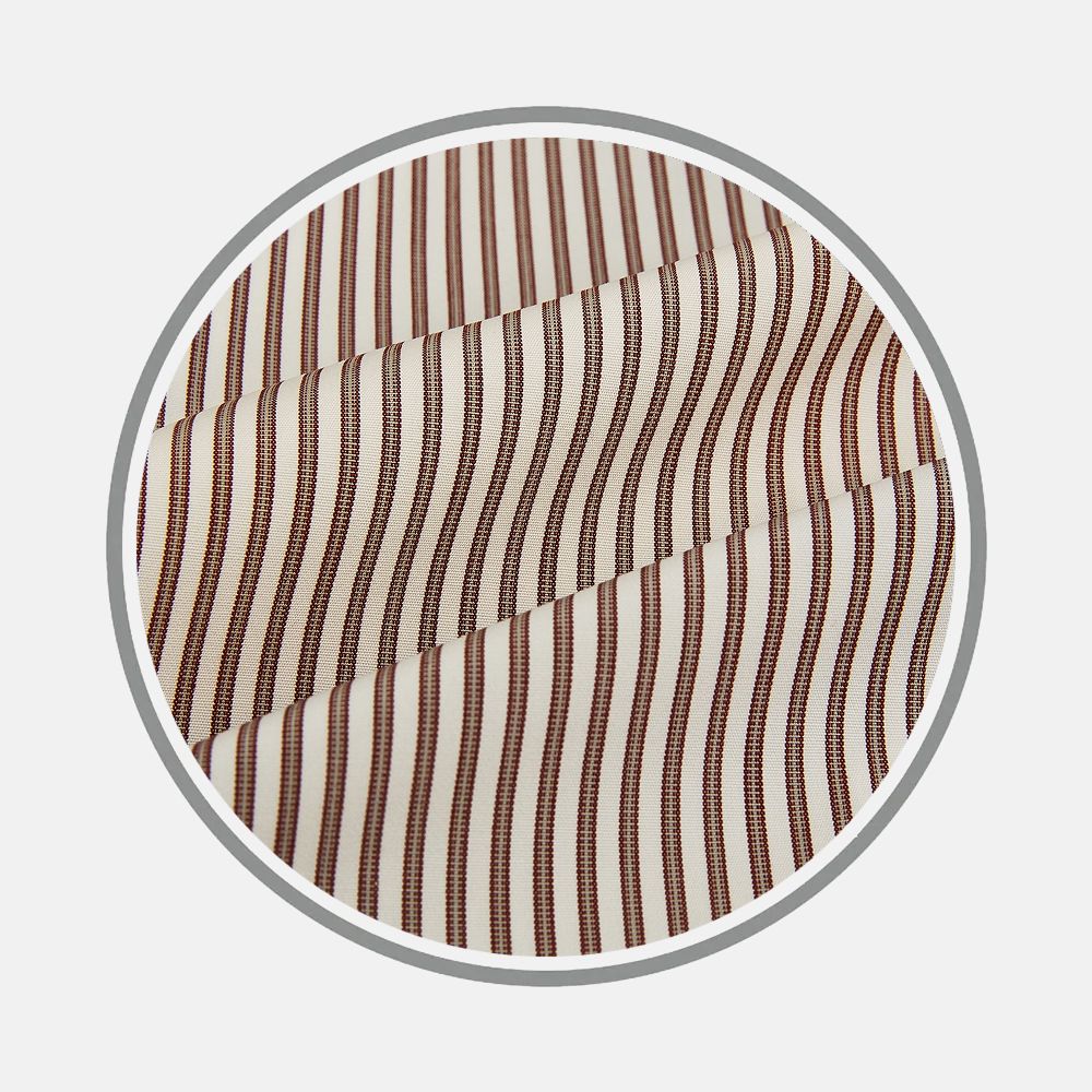 Close-up of Turnbull & Asser's Burgundy Halo Stripe Fabric, featuring vertical brown and white stripes, displayed within a circular frame on a plain light background.