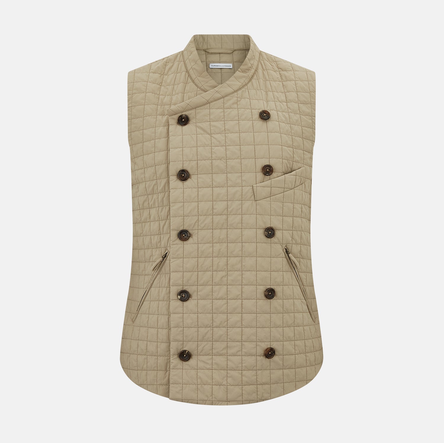 View 1 of product The Turnbull & Asser Sand Double-Breasted Quilted Gilet features a sleeveless design, brown buttons, slanted chest pocket, and two zippered side pockets—perfect for modern layered dressing. Shown on a plain white background.