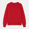 View 5 of product The Turnbull & Asser Raspberry Red Cashmere Edwards V-Neck Sweater features long sleeves, ribbed cuffs and hem, and is shown laid flat on a white background.