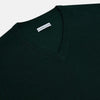 View 2 of product The Turnbull & Asser Forest Green Fine Merino V-Neck Jumper features long sleeves, ribbed cuffs and hem—classic knitwear for any wardrobe, shown on a white background.