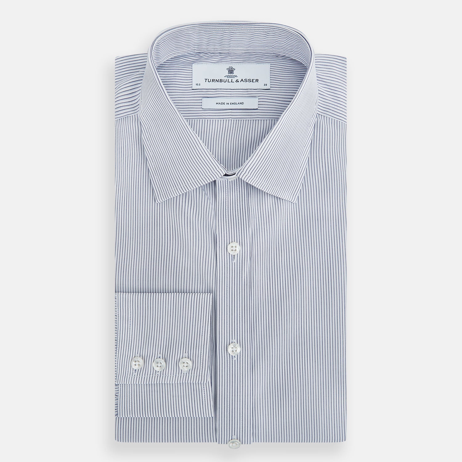 View 5 of product The Navy and White Ticking Stripe Mayfair Shirt by Turnbull & Asser features long sleeves, buttoned cuffs, a pointed T&A collar, and button-up front, shown on a plain white background.