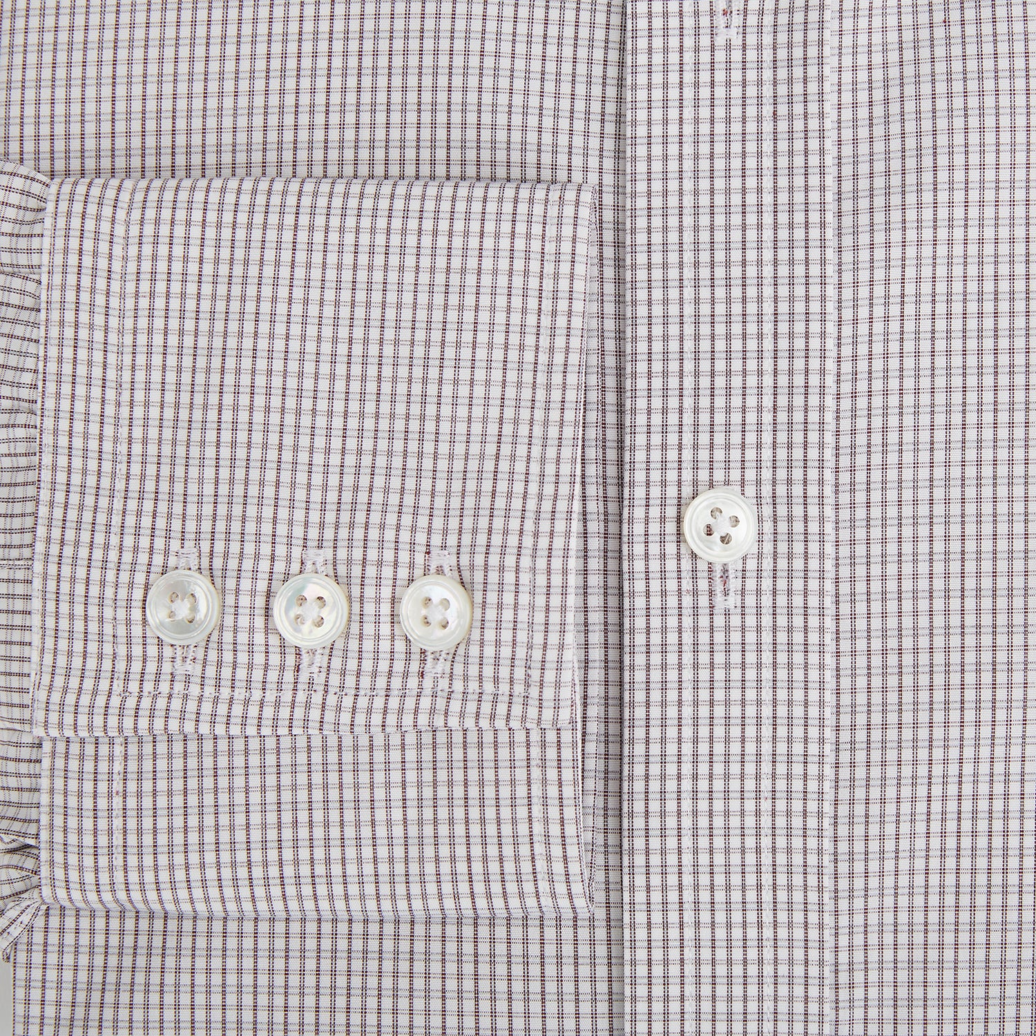 View 4 of product The Turnbull & Asser Burgundy Micro Tattersall Check Mayfair Shirt, crafted from Italian cotton with long sleeves, a button-down front, collar, and buttoned cuffs, is shown on a white background.