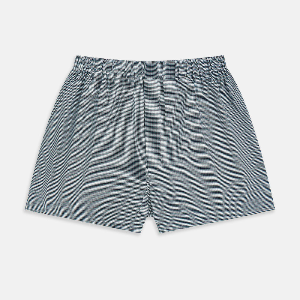 Turnbull & Asser Green Houndstooth Godfrey Boxer Shorts with an elastic waistband, showcasing a small black and white houndstooth pattern, are laid flat on a white background.