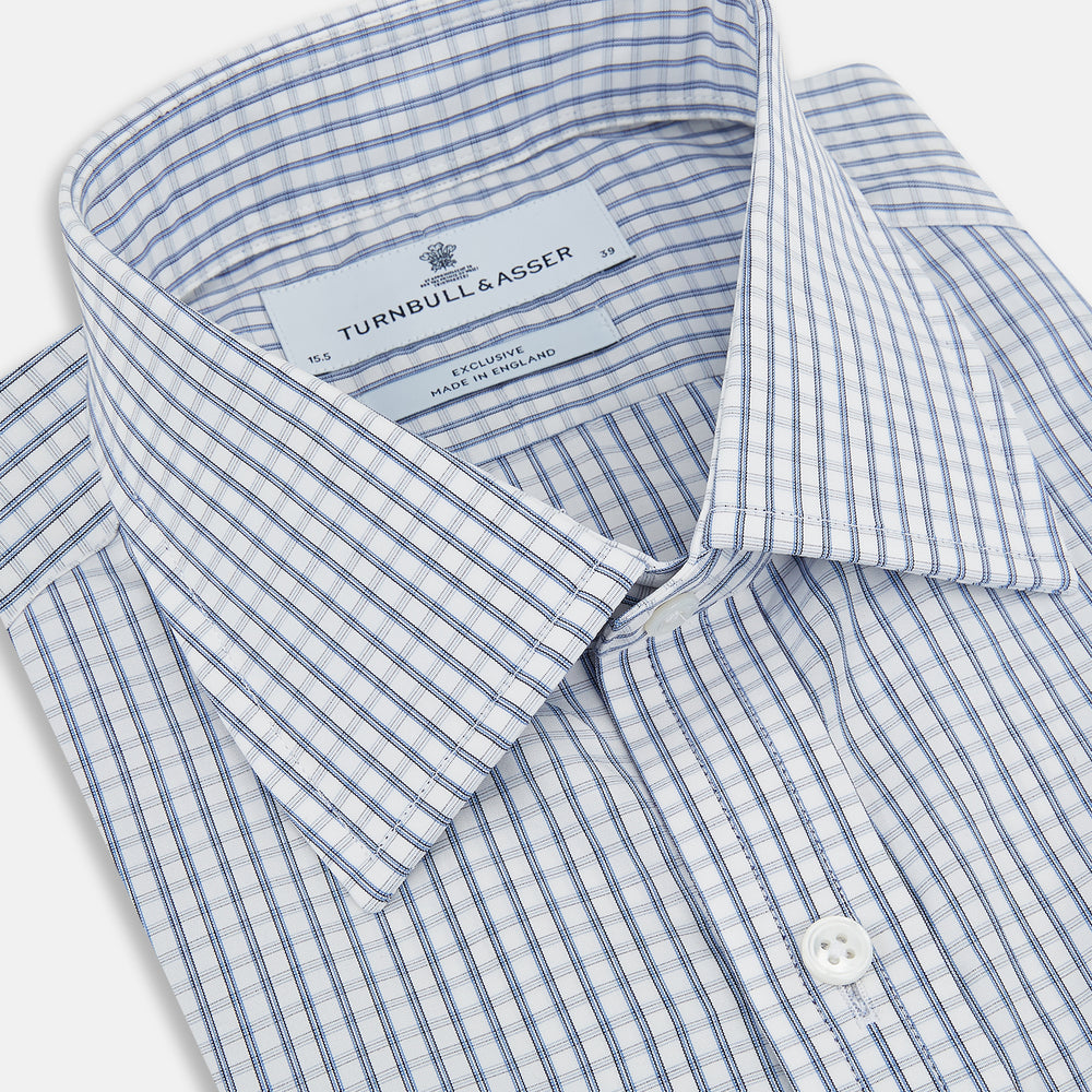 The Turnbull & Asser Blue Multi Tattersall Check Mayfair Shirt is a long-sleeved, button-down shirt featuring a small blue and white check pattern, pointed collar, and cuffs, shown laid flat on a white background.